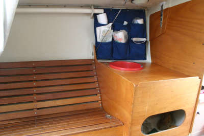 Galley & settee--port. Note bruynzeel plywood bulkhead